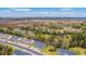 Scenic aerial view highlighting new townhomes set amidst lush greenery with a river off in the distance at 7803 Park Gate Dr, Charleston, SC 29418