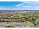 Scenic aerial view of new construction homes with community pond and marsh views at 7803 Park Gate Dr, Charleston, SC 29418