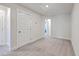 Simple bedroom with neutral carpet, trim, and a useful linen closet at 7803 Park Gate Dr, Charleston, SC 29418