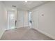 Upstairs hallway features neutral carpet and white trim at 7803 Park Gate Dr, Charleston, SC 29418