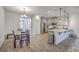 Open floorplan showing the dining room blending seamlessly into the modern kitchen at 7803 Park Gate Dr, Charleston, SC 29418
