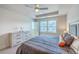 The main bedroom suite boasts a ceiling fan and plenty of natural light at 7803 Park Gate Dr, Charleston, SC 29418