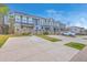 A row of well-maintained townhomes featuring individual driveways for convenient parking at 7803 Park Gate Dr, Charleston, SC 29418