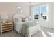 Inviting bedroom with patterned wallpaper, bright windows, and cottage decor at 790 Clay Field Trl, Summerville, SC 29485