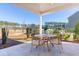 Inviting covered patio with views of a beautifully landscaped backyard at 790 Clay Field Trl, Summerville, SC 29485