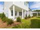 Inviting backyard with covered patio, lush lawn, and manicured landscaping at 792 Clay Field Trl, Summerville, SC 29485