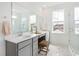 Well-lit bathroom with double sinks, a vanity area, and a walk-in shower at 792 Clay Field Trl, Summerville, SC 29485