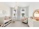 Cozy Bedroom with a crib, rocker, soft lighting, and stylish decor at 792 Clay Field Trl, Summerville, SC 29485
