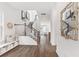 Bright entryway showcasing hardwood floors, staircase, and stylish decor for a welcoming first impression at 792 Clay Field Trl, Summerville, SC 29485