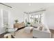Bright living room with white furniture, large windows, and stylish decor at 792 Clay Field Trl, Summerville, SC 29485