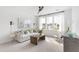 Comfortable living room with a ceiling fan, bright windows, and cozy furniture at 792 Clay Field Trl, Summerville, SC 29485