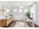 Well-lit office space with a wooden desk, stylish decor, and large windows at 792 Clay Field Trl, Summerville, SC 29485