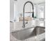 Modern kitchen sink and granite countertop with a stylish faucet, perfect for a contemporary home at 792 Clay Field Trl, Summerville, SC 29485