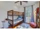 Cozy bedroom with a bunk bed, hardwood floors and a window overlooking the landscape at 8115 Adams Run School Rd, Adams Run, SC 29426