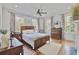 Cozy bedroom with wood floors, neutral walls, and lots of natural light from multiple windows at 8115 Adams Run School Rd, Adams Run, SC 29426