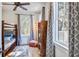 Inviting bedroom featuring a bunk bed, stylish decor, and a cozy atmosphere with ample natural light at 8115 Adams Run School Rd, Adams Run, SC 29426