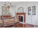 Cozy dining area with hardwood floors, wood-burning fireplace and natural light at 8115 Adams Run School Rd, Adams Run, SC 29426
