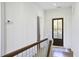 Hallway with white wood paneling and a dark wooden door leading to the outside at 8115 Adams Run School Rd, Adams Run, SC 29426