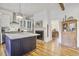 Spacious kitchen showcasing a large center island, stainless appliances, and bright lighting at 8115 Adams Run School Rd, Adams Run, SC 29426