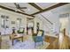 Spacious living room with wooden floors, ceiling fan, staircase and stylish décor accents at 8115 Adams Run School Rd, Adams Run, SC 29426