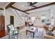 Bright living room with exposed beam ceilings, hardwood floors, and comfortable seating at 8115 Adams Run School Rd, Adams Run, SC 29426