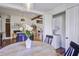 Bright living room with wooden beams, hardwood floors, a fireplace, and a convenient laundry closet at 8115 Adams Run School Rd, Adams Run, SC 29426