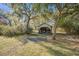 Vintage shed surrounded by mature trees draped with Spanish moss at 8115 Adams Run School Rd, Adams Run, SC 29426