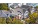 Aerial view of a beautiful home surrounded by trees and showcasing the property's landscaping and curb appeal at 873 Tupelo Bay Dr, Mount Pleasant, SC 29464