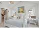 Spacious primary bedroom with light wood floors, white accents, and a charming chandelier at 873 Tupelo Bay Dr, Mount Pleasant, SC 29464