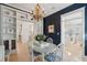 Charming dining area with stylish decor, featuring a chandelier, table with seating, and attractive built-ins at 873 Tupelo Bay Dr, Mount Pleasant, SC 29464