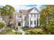 Charming two-story home featuring a landscaped yard and inviting walkway to the front door at 873 Tupelo Bay Dr, Mount Pleasant, SC 29464