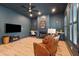 Comfortable living room featuring a cozy fireplace, ceiling fan, hardwood floors and custom built-in desks at 873 Tupelo Bay Dr, Mount Pleasant, SC 29464