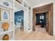 Open-concept living room and dining area featuring hardwood floors and custom built-ins at 873 Tupelo Bay Dr, Mount Pleasant, SC 29464