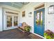 Welcoming porch with a comfortable bench, stylish décor, and a painted blue door at 873 Tupelo Bay Dr, Mount Pleasant, SC 29464
