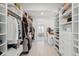 Expansive walk-in closet featuring custom shelving, drawers, and a vanity area at 873 Tupelo Bay Dr, Mount Pleasant, SC 29464