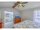 This bedroom offers a vaulted ceiling, ceiling fan, and access to an ensuite bathroom at 891 Wynford Ct, Mount Pleasant, SC 29464