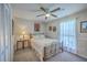 Charming bedroom featuring a decorative metal bed frame and bright natural light from a large window at 891 Wynford Ct, Mount Pleasant, SC 29464