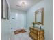 Stylish entryway with tiled floors, decorative mirror, and elegant wooden dresser at 891 Wynford Ct, Mount Pleasant, SC 29464