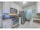 Classic kitchen features stainless appliances, granite counters, and white cabinets at 891 Wynford Ct, Mount Pleasant, SC 29464