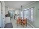 Cozy kitchen with white cabinets, modern appliances, and a breakfast nook with natural light at 891 Wynford Ct, Mount Pleasant, SC 29464