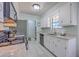 Well-maintained kitchen with stainless steel appliances, white cabinets, and granite countertops at 891 Wynford Ct, Mount Pleasant, SC 29464