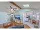 Open living space with hardwood floors connecting to kitchen and featuring comfortable furniture and skylight at 891 Wynford Ct, Mount Pleasant, SC 29464