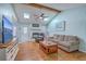 Bright living room featuring hardwood floors, skylights, fireplace, and comfortable seating at 891 Wynford Ct, Mount Pleasant, SC 29464