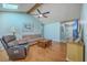 Bright living room with hardwood floors, skylight, ceiling fan and comfortable seating at 891 Wynford Ct, Mount Pleasant, SC 29464