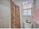 Shower area with a brown patterned curtain and a small window for natural light at 891 Wynford Ct, Mount Pleasant, SC 29464