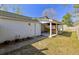 Side exterior of home with covered patio, perfect for outdoor living at 9861 Levenshall Dr, Ladson, SC 29456