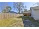 Large backyard with mature trees and a fence, offering plenty of space at 9861 Levenshall Dr, Ladson, SC 29456
