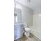Modern bathroom with a vanity, toilet, shower and tub combo, and wood floors at 9861 Levenshall Dr, Ladson, SC 29456