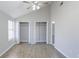 Bright bedroom with vaulted ceiling, light wood floors, and convenient closet spaces at 9861 Levenshall Dr, Ladson, SC 29456