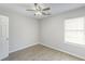 Clean bedroom with wood floors, a window, and a door leading outside the room at 9861 Levenshall Dr, Ladson, SC 29456